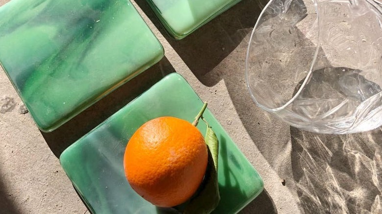 Orange on green glass coasters