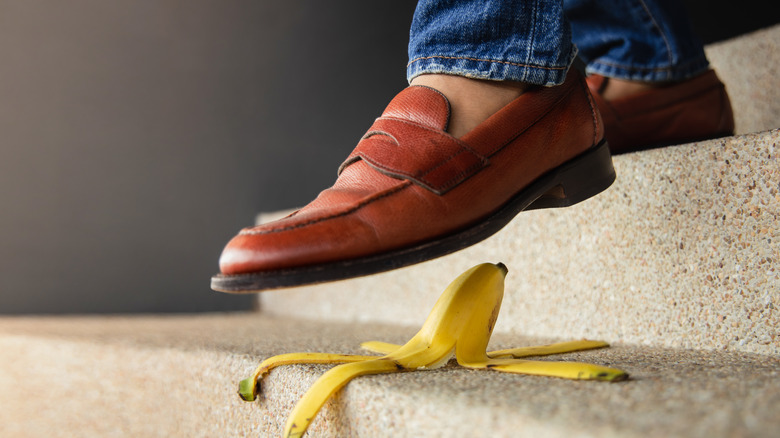 foot stepping onto banana peel