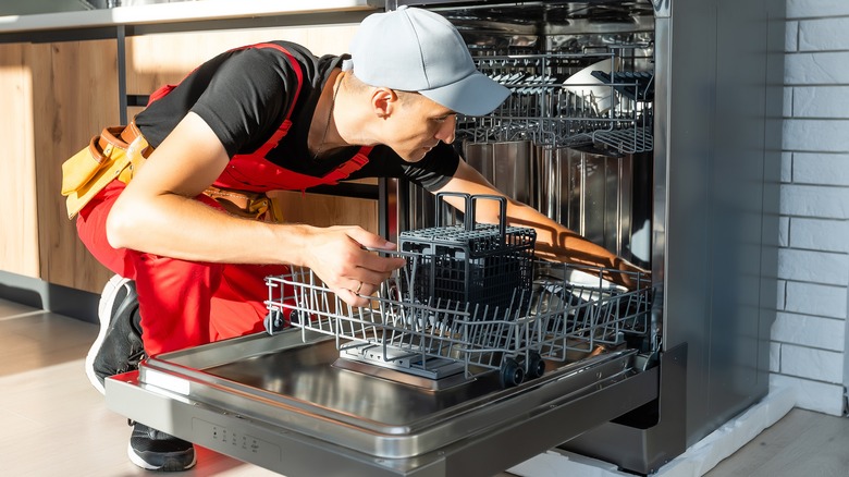 Technician installing dishwasher