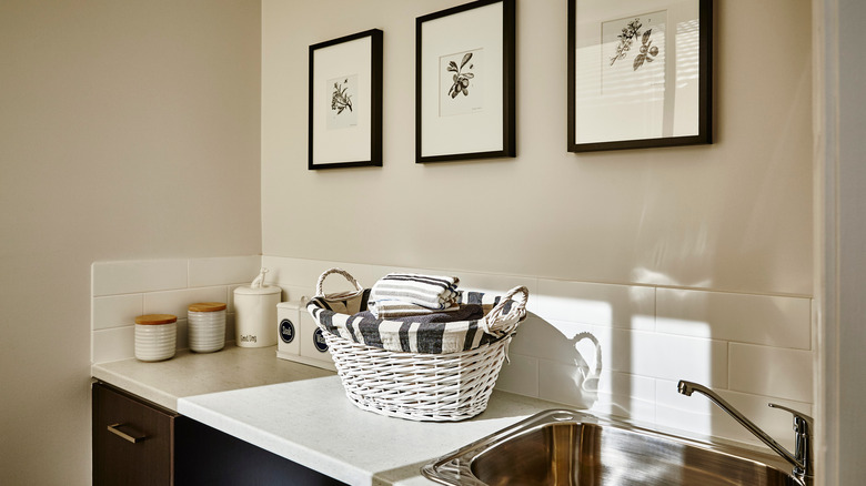 contemporary laundry room with art