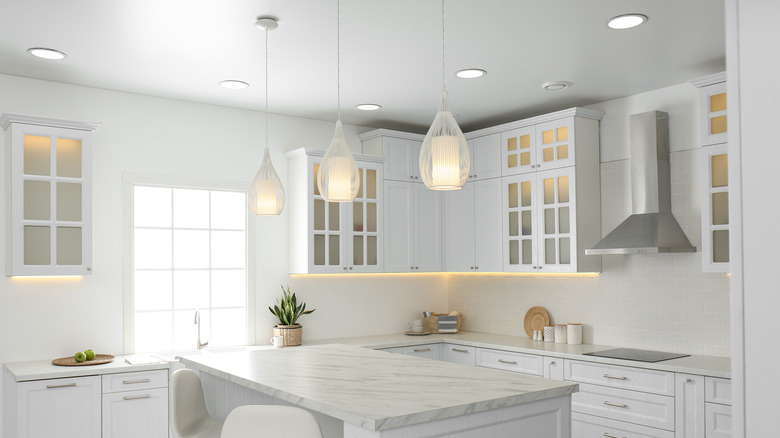 White kitchen with lighting