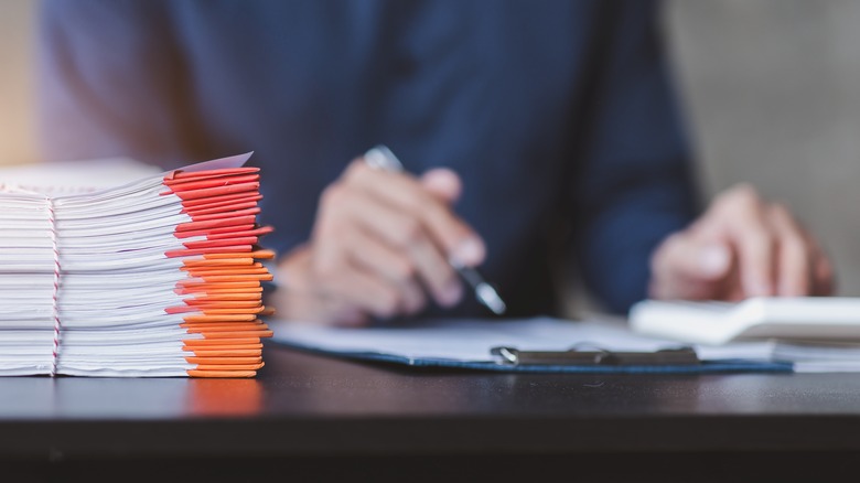 person doing paperwork