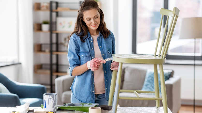 lady painting chair