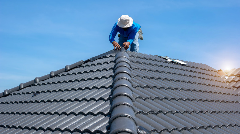 Man repairing a roof