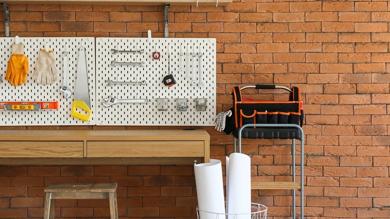 tools on a white pegboard