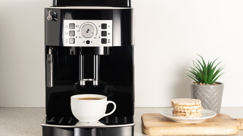 Coffee maker with cup of coffee