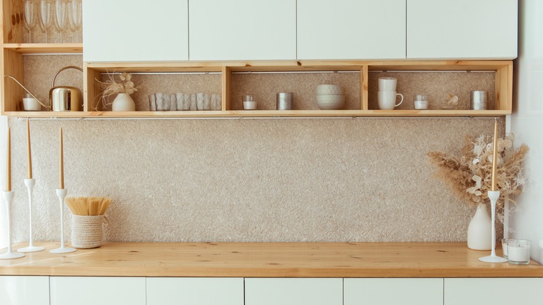 Wooden shelf under kitchen cabinets