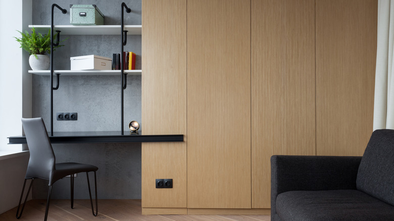 wooden closet next to desk