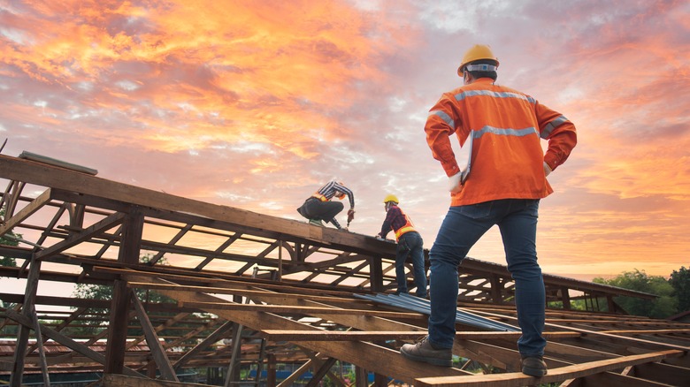 team building a roof