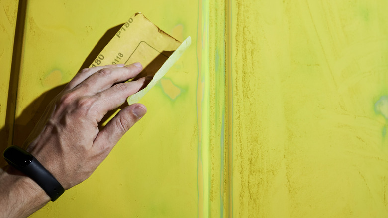 man preparing yellow surface