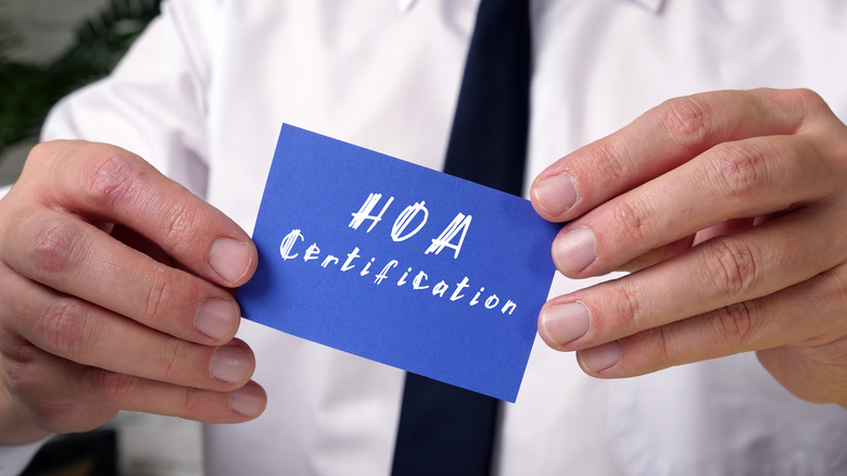 Person holding HOA certification