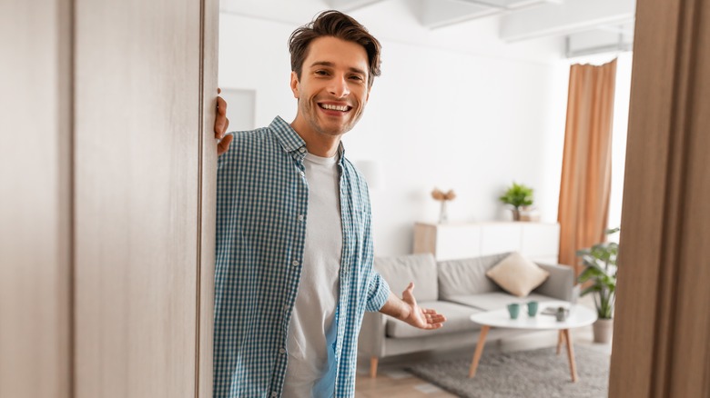 man opening the front door