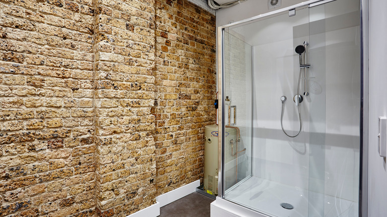 modern bathroom with brick wall