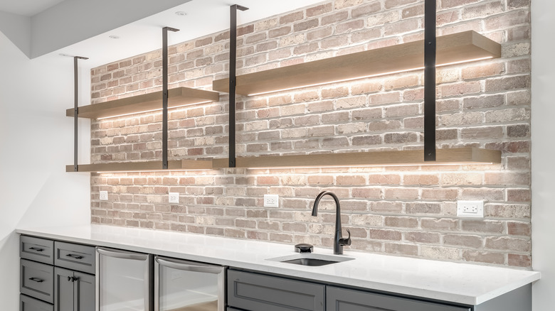 kitchen with exposed brick wall