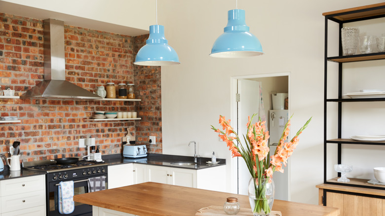 minimalistic kitchen with brick wall