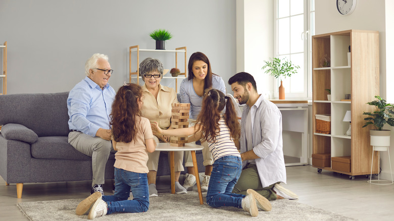 a family playing jenga