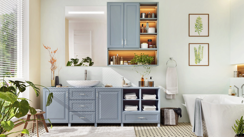 Blue Shaker cabinetry in bathroom