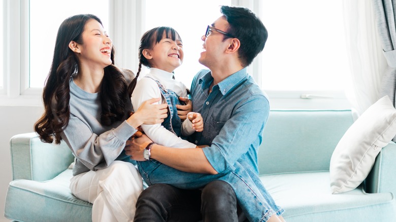 Happy family sits on couch