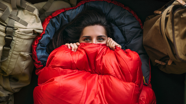 woman using sleeping bag