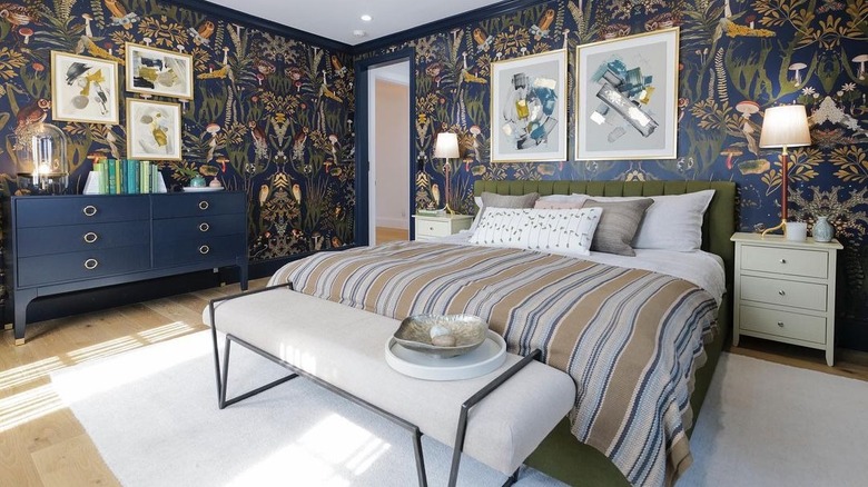 patterned wallpaper bedroom with green and navy blue