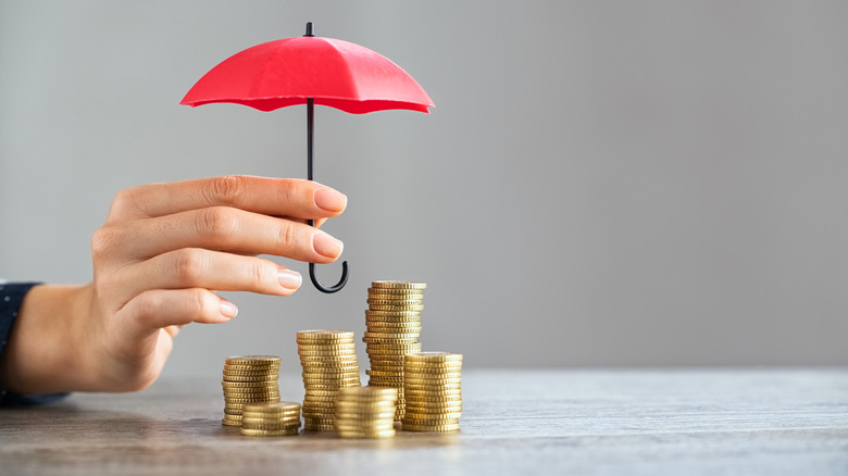 coins under an umbrella