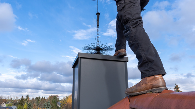 person cleaning home's chimney