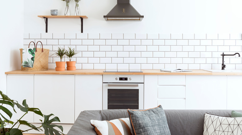 White kitchen, terra cotta accents