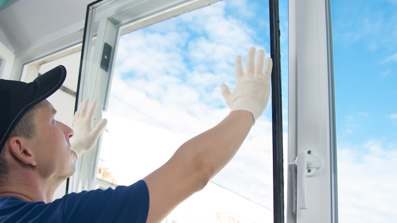 Person installing double glazed window