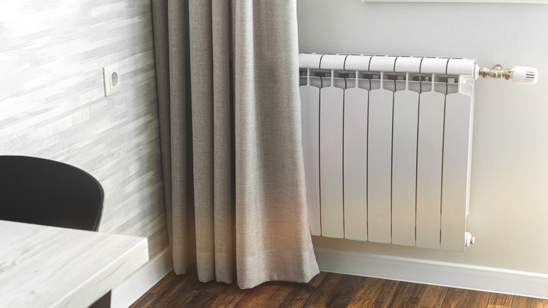 radiator behind a curtain