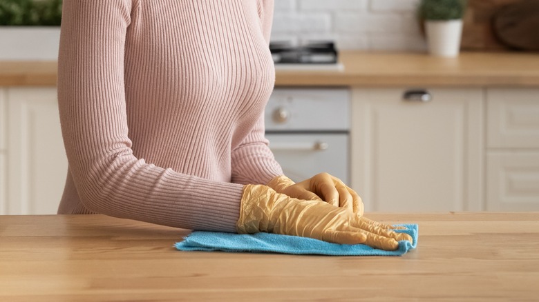 woman cleaning counter