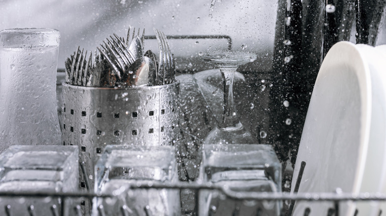 silverware being washed in dishwasher