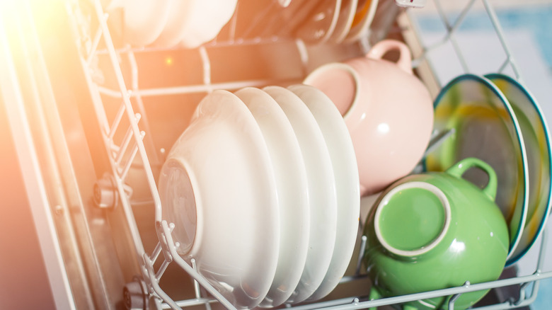 stacked dishes in dishwasher