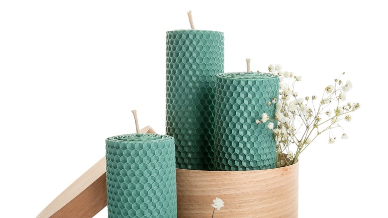 green candles on white background