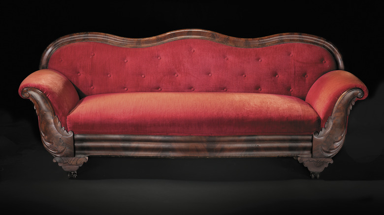 an antique, tufted couch