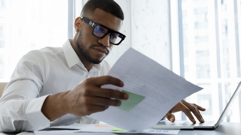 Person reading over a document