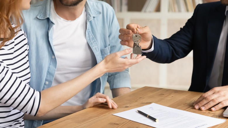 realtor handing the keys over