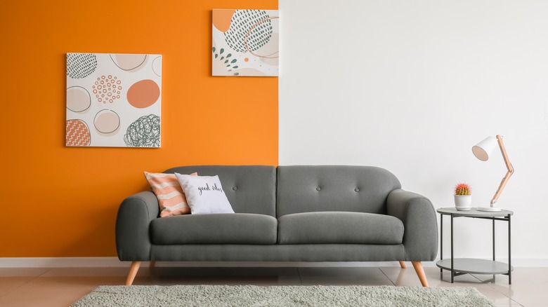 Room with orange and white accent wall