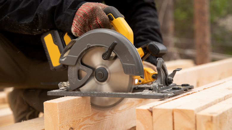 table saw cutting wood