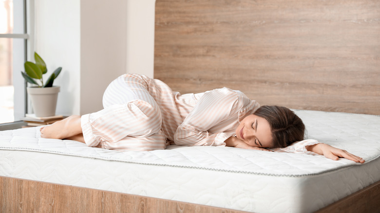 Lady lying on mattress