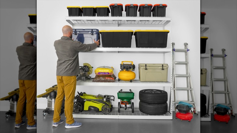 Man stacking item on wire shelves