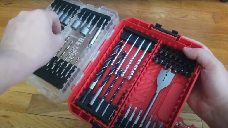 Person taking drill bits out of a Craftsman drill bit set