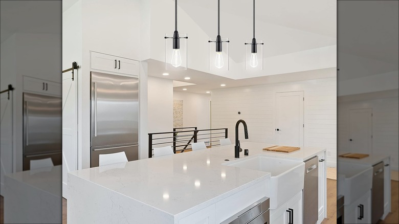 Pendant lights over white kitchen island