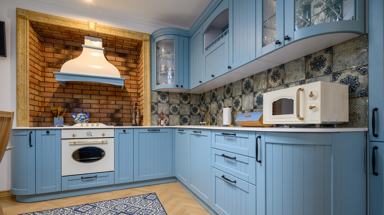 Blue cabinetry in kitchen area