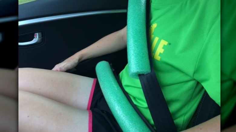 green pool noodles covering a seatbelt