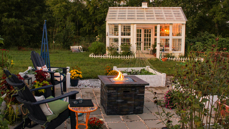 outdoor seating area and shed