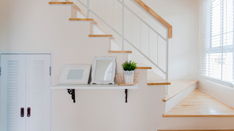 simple shelf under staircase