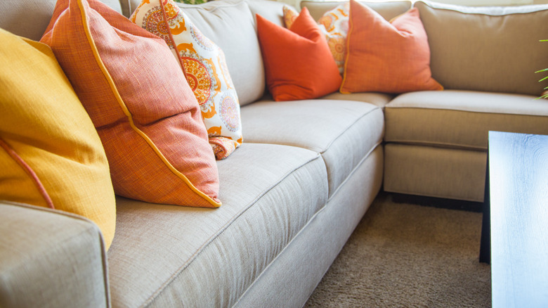 orange throw pillows on couch