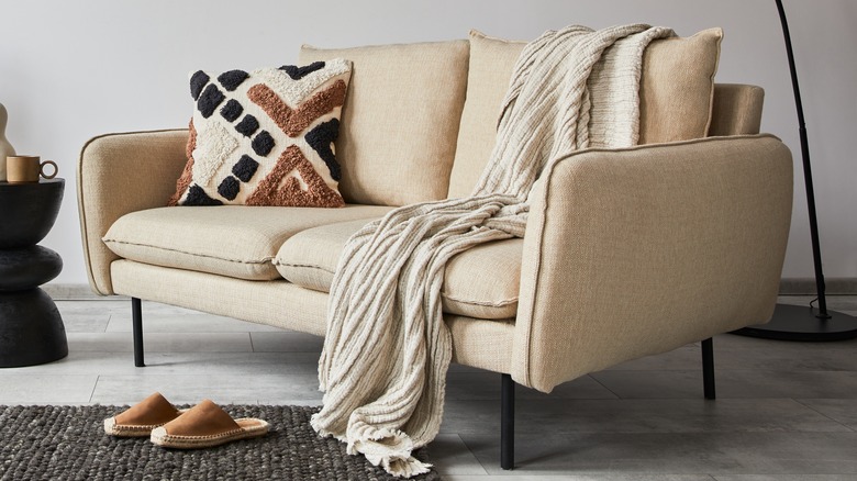 Sofa with blankets and pillows