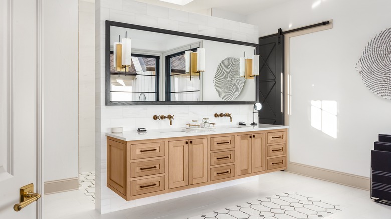 bathroom with wood cabinets