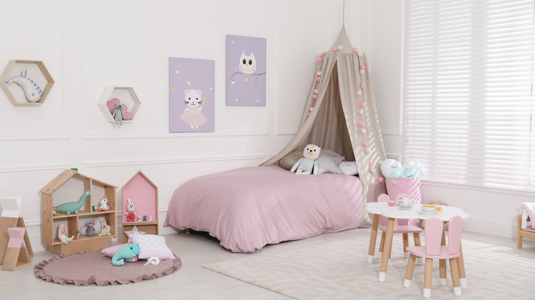 taupe canopy over child's bed